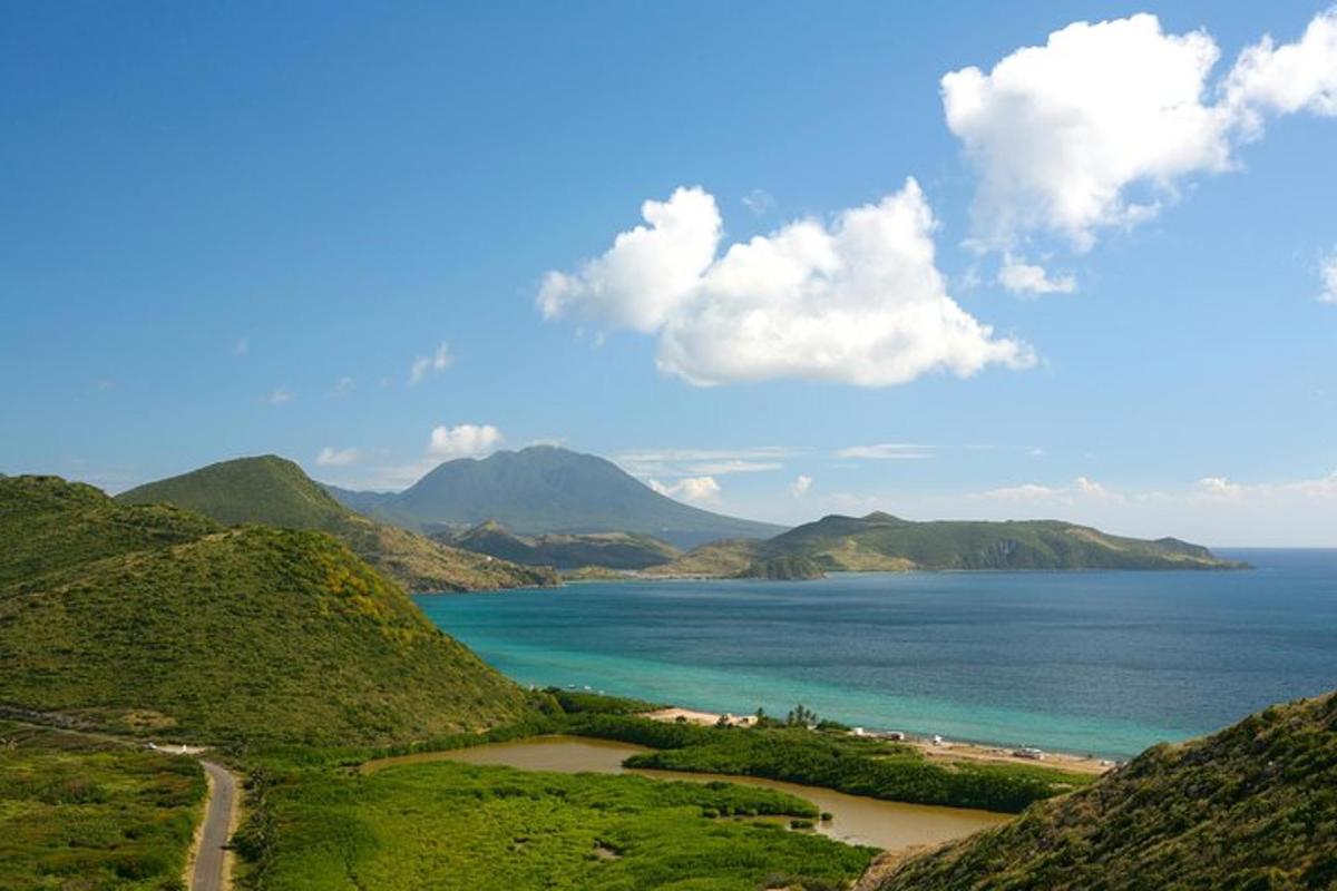 a view of the ocean with mountains in the background