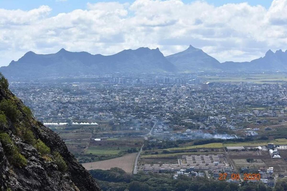 a view of a city with mountains in the background