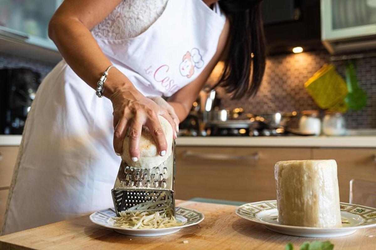 a woman in a kitchen preparing food on a table