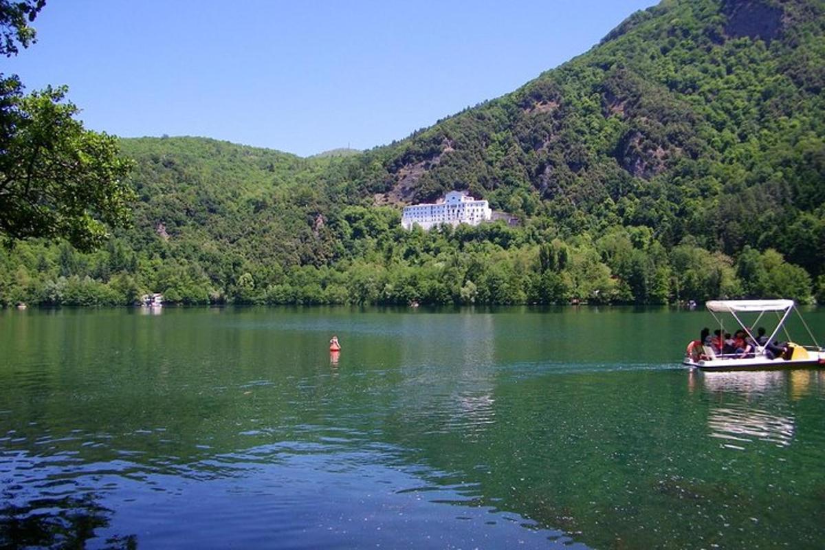 a group of people in a boat on a lake