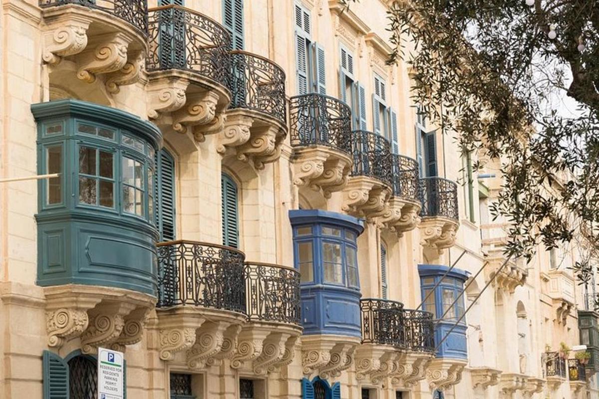 a building with blue windows and balconies on it