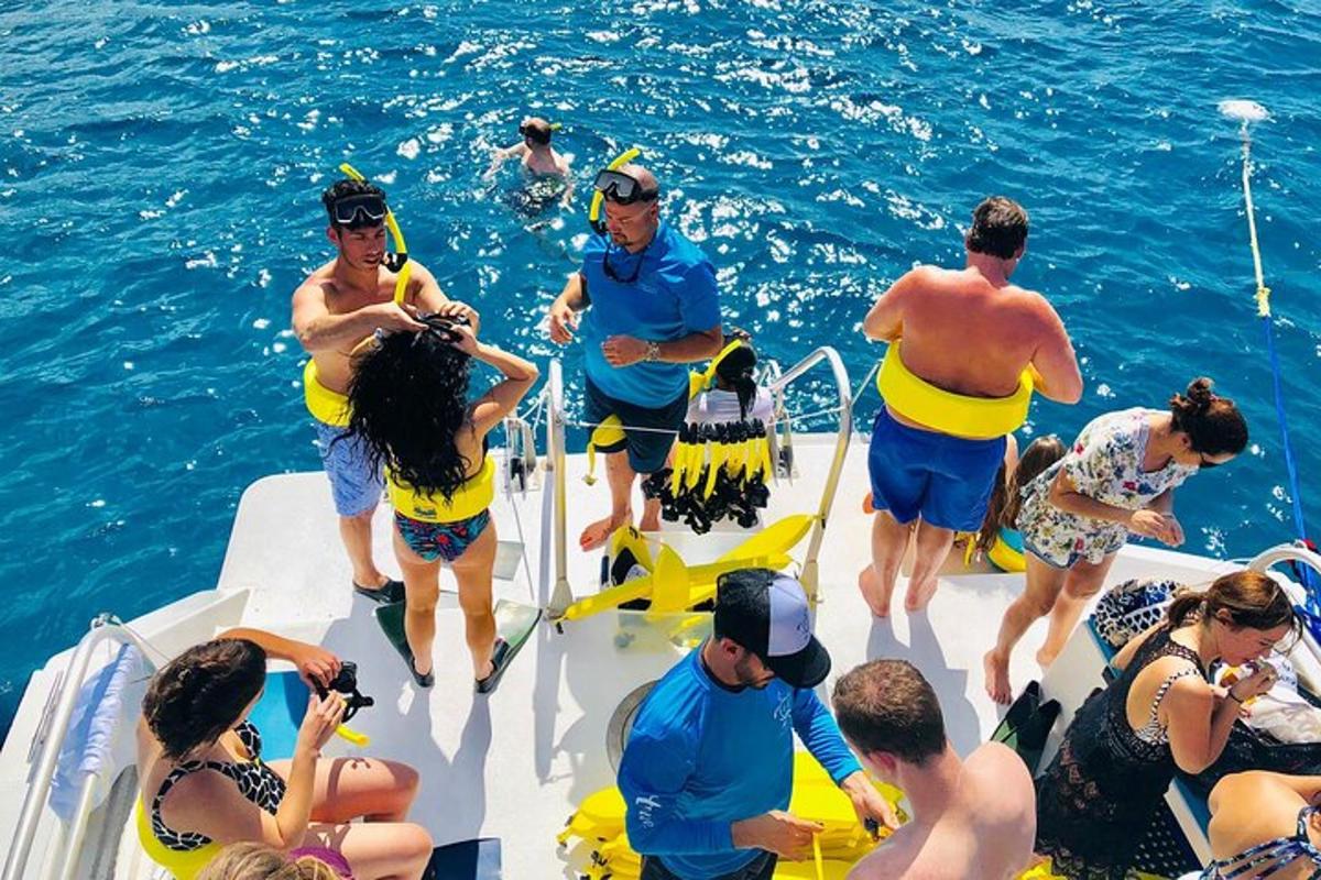a group of people on a boat in the water