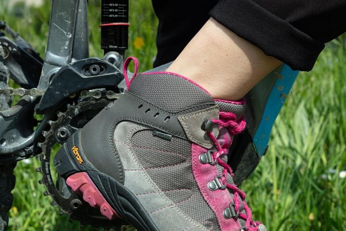 a person with their foot on a bike