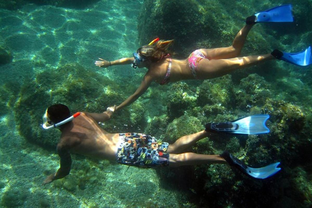 two people are swimming in the water