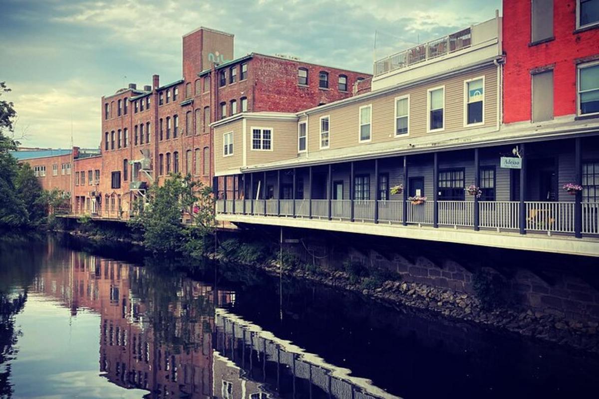 a bridge over a river in a city with buildings