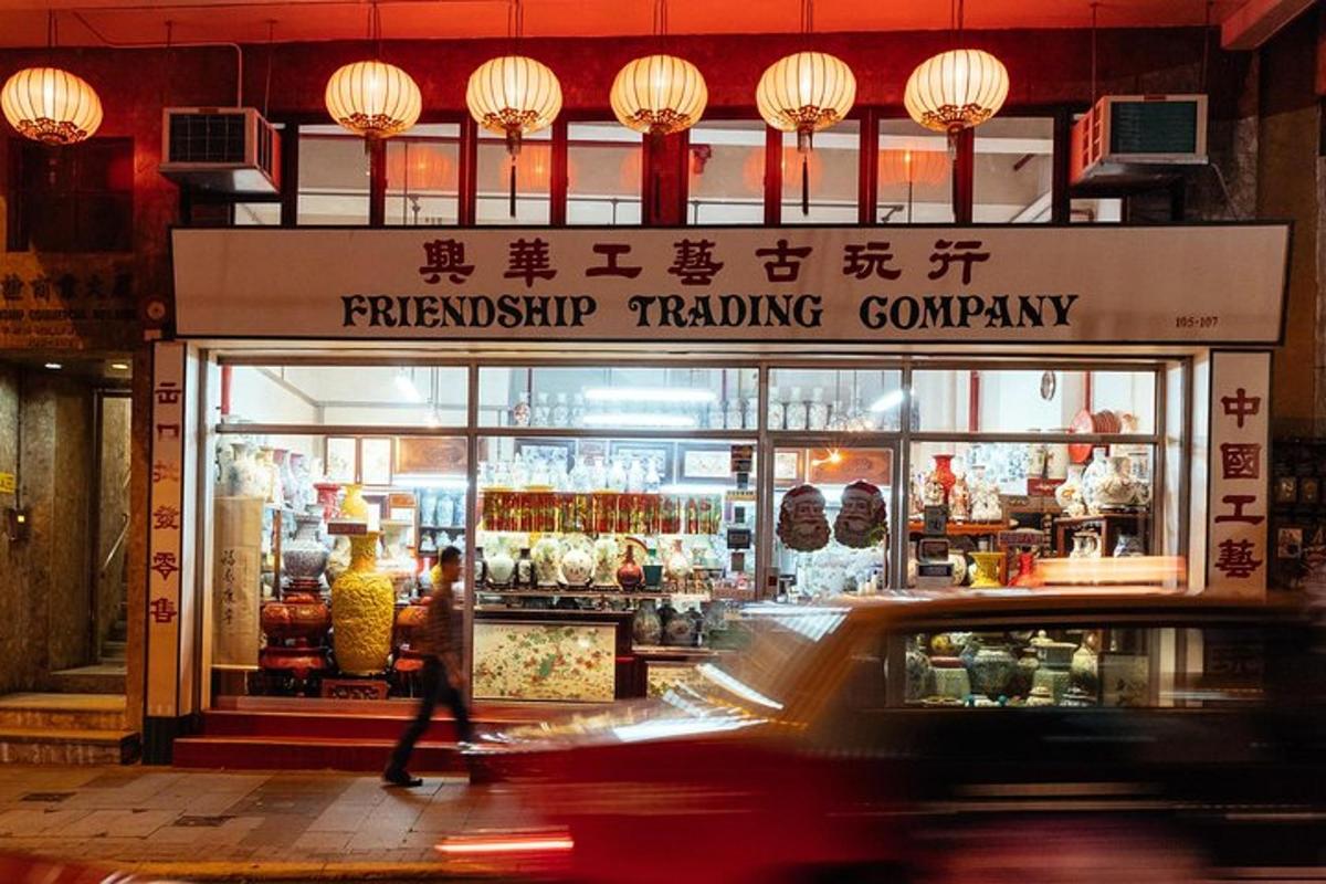 a car driving in front of a pharmacy trading company