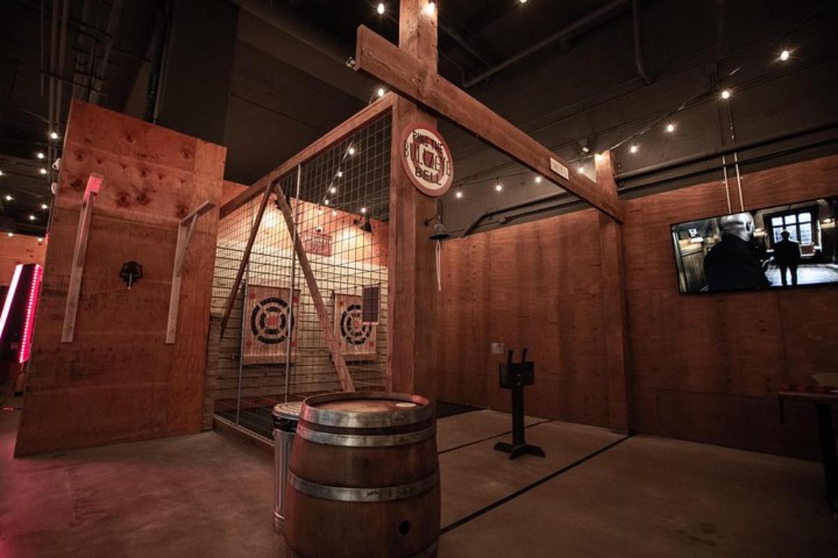 a room with a barrel and a cross on the wall