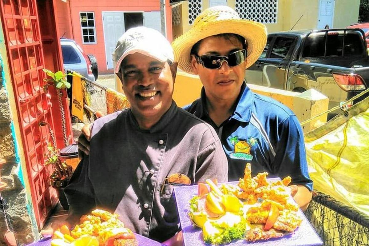 two men standing with a table of food