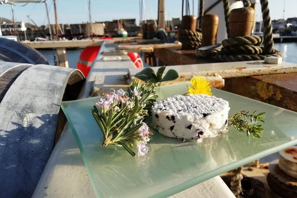 a plate with flowers on a table on a boat