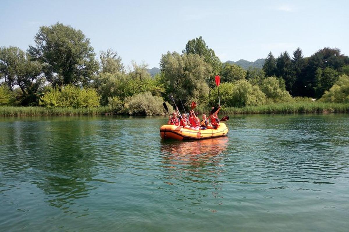 a group of people in a raft on a river