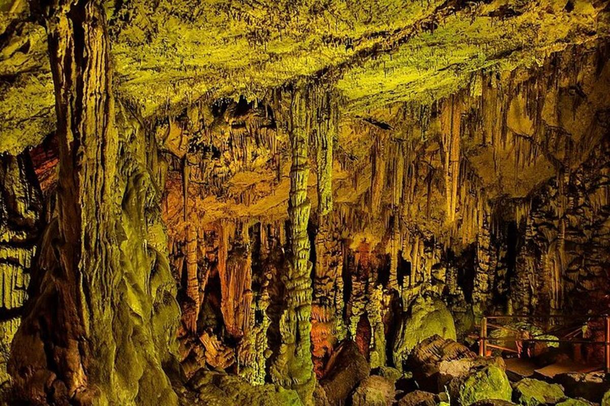 a painting of a cave with stalactites