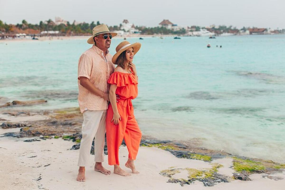 a man and a woman standing on the beach