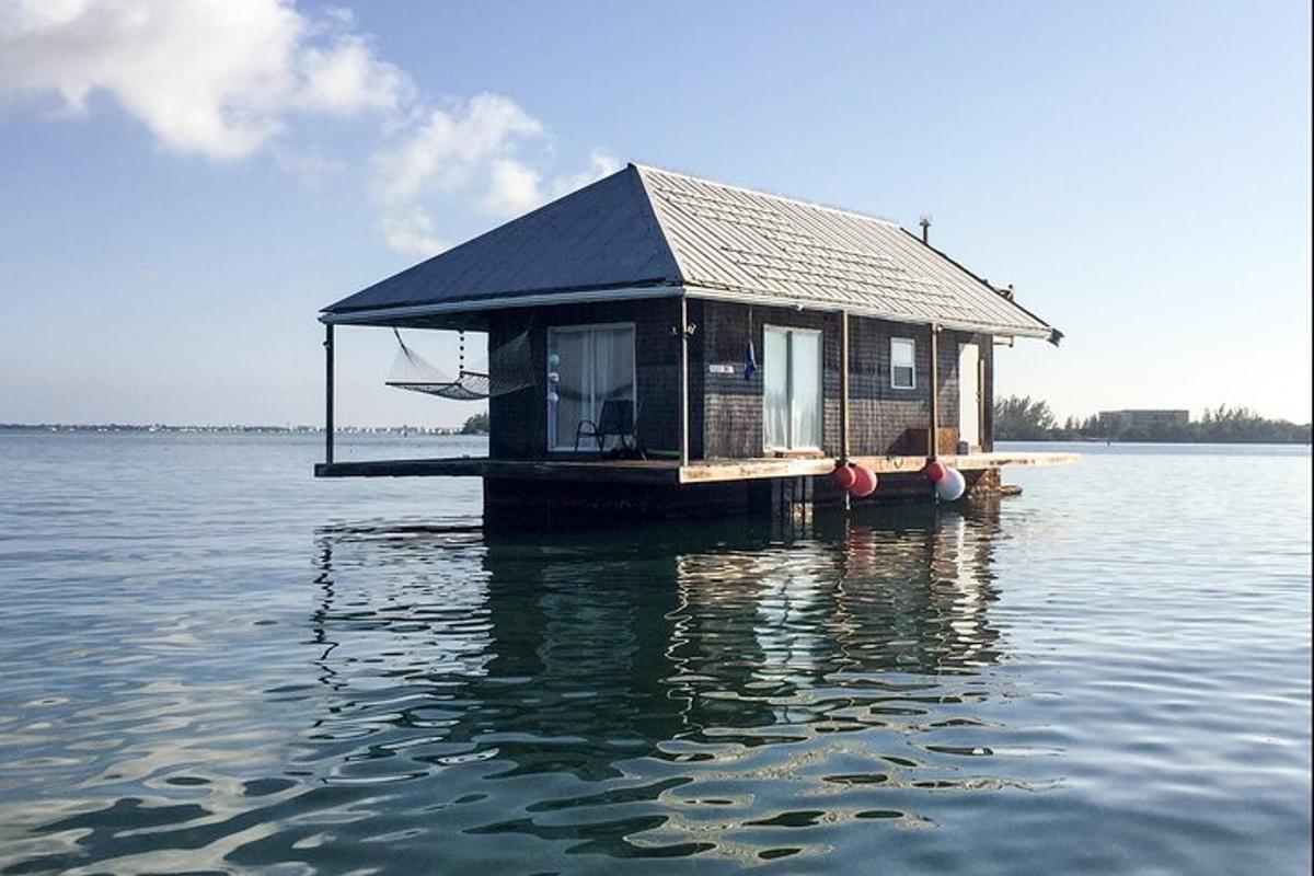 a house on a floating island in the water