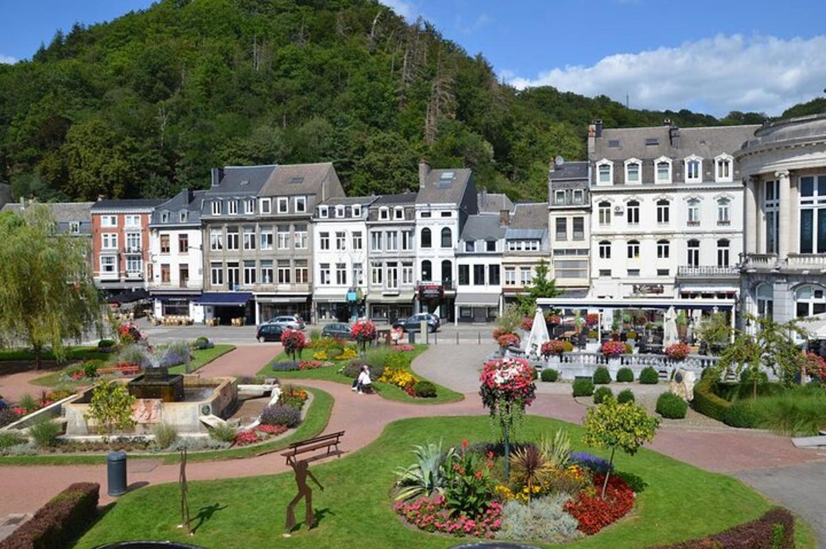 a town with buildings and a park with flowers