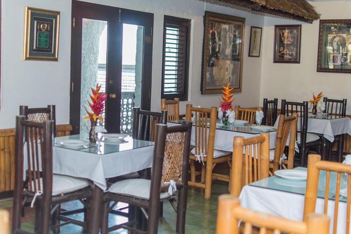 a dining room with tables and chairs in a restaurant