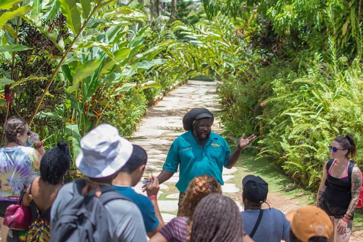 a man talking to a group of people on a trail