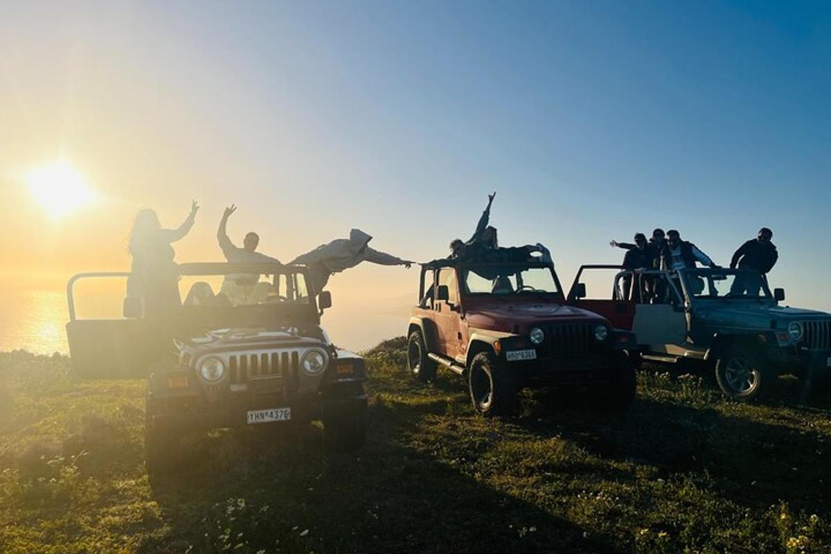 a group of people jumping off the back of their jeep