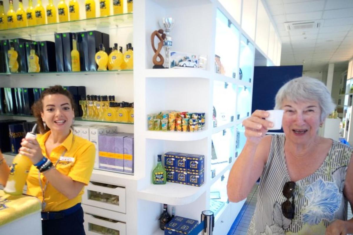 two women standing in a store taking a picture