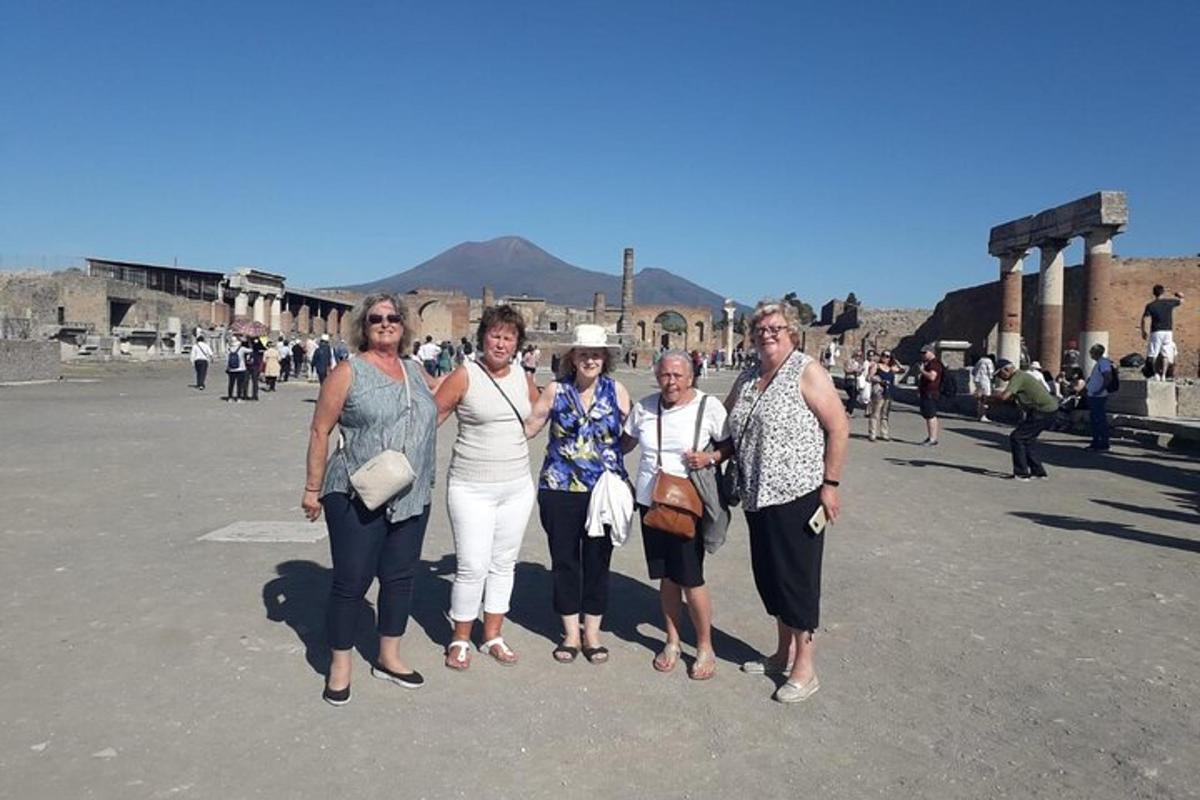 a group of women standing in a parking lot