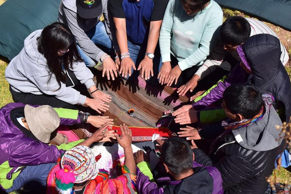 a group of people holding their hands in a circle