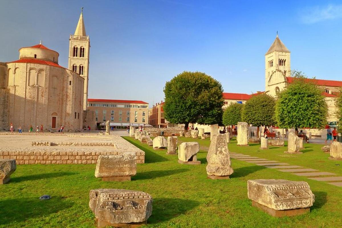 a cemetery with stone seats in front of a building