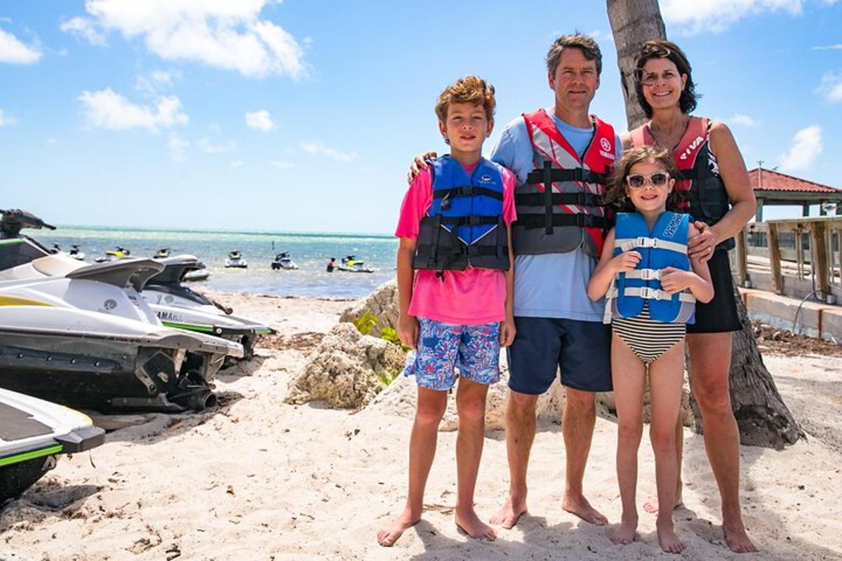 a family posing for a picture on the beach