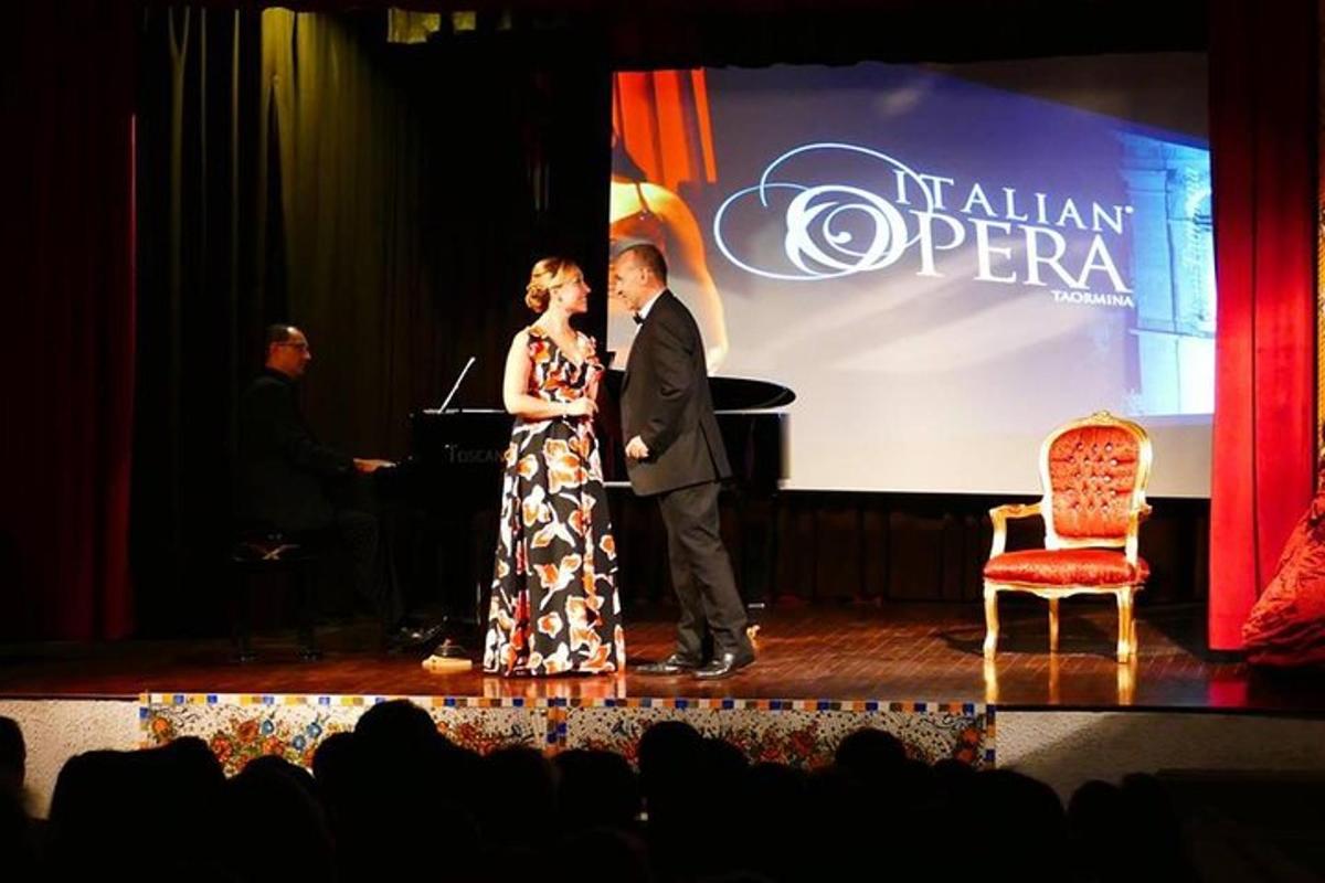 a man and a woman standing on a stage