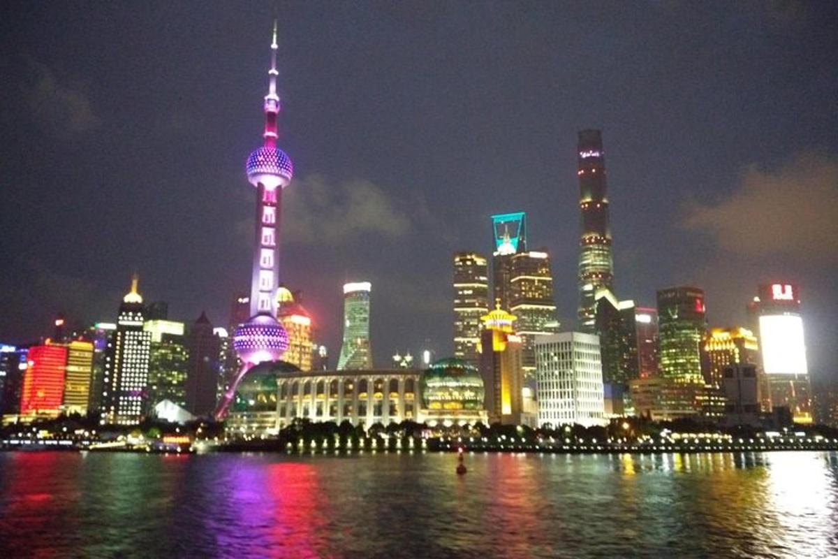 a view of a large city at night with a river
