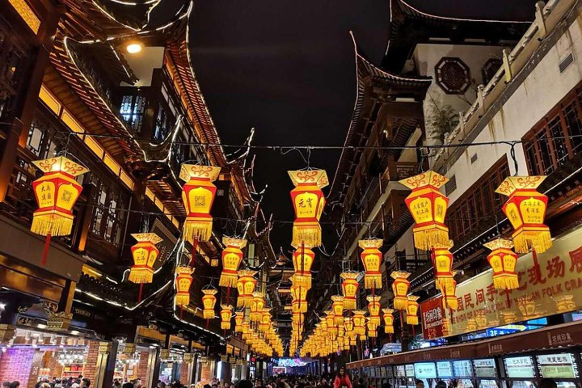 a group of yellow lights hanging from a building