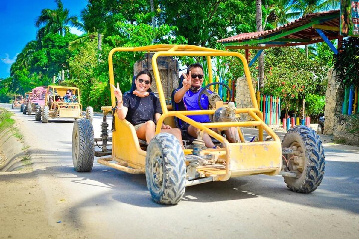 a man and woman riding in an old car