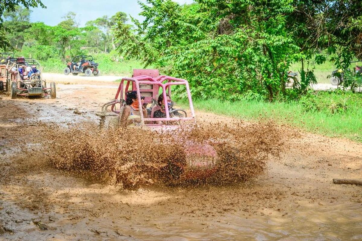 a dirt car driving through a mud field