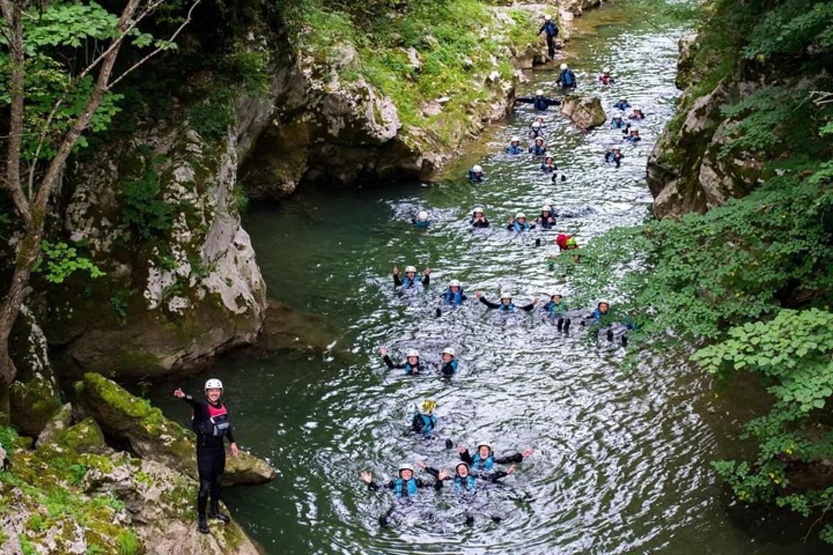 a group of people swimming in a river