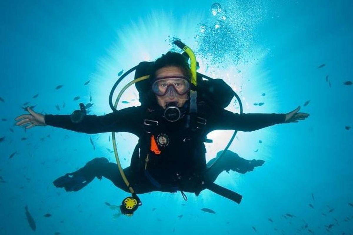 a man in a diver suit in the water