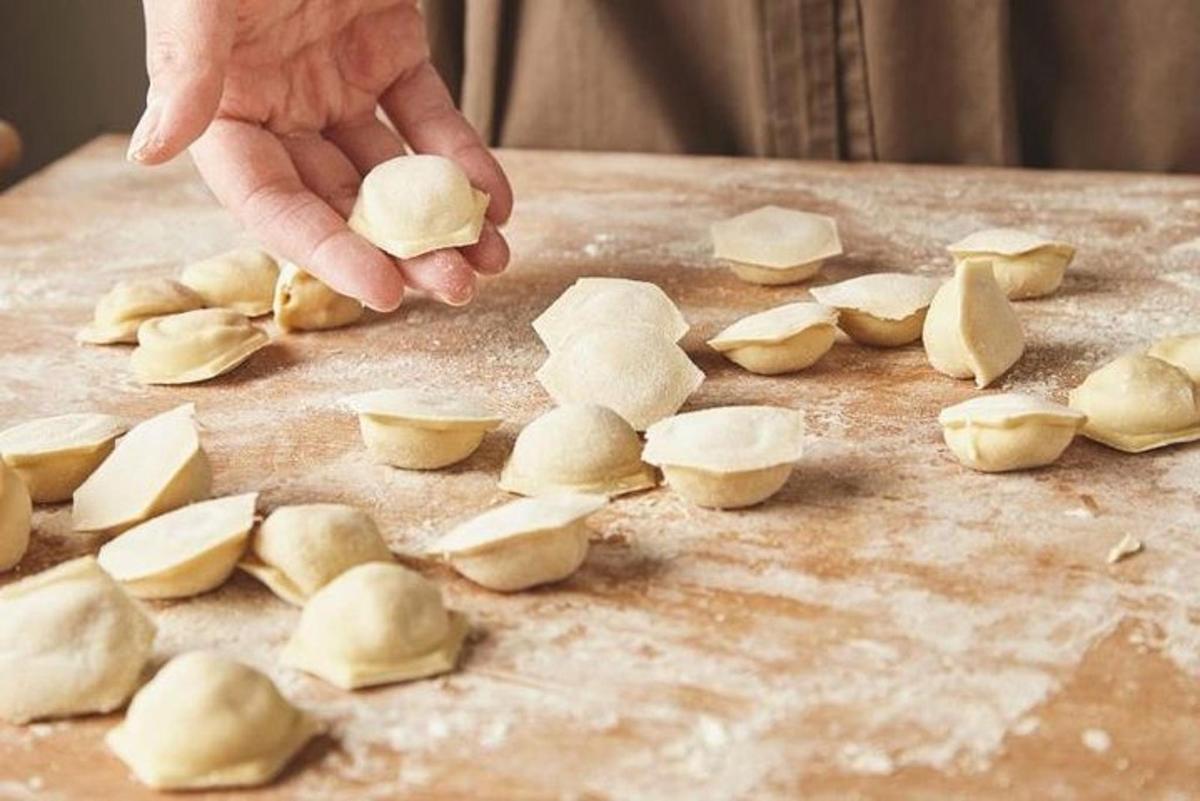 a person is cutting up onions on a cutting board