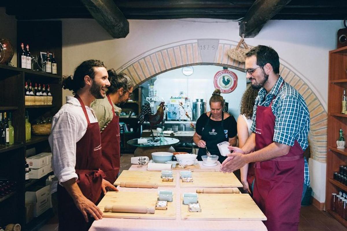 a group of people standing around a table in a kitchen