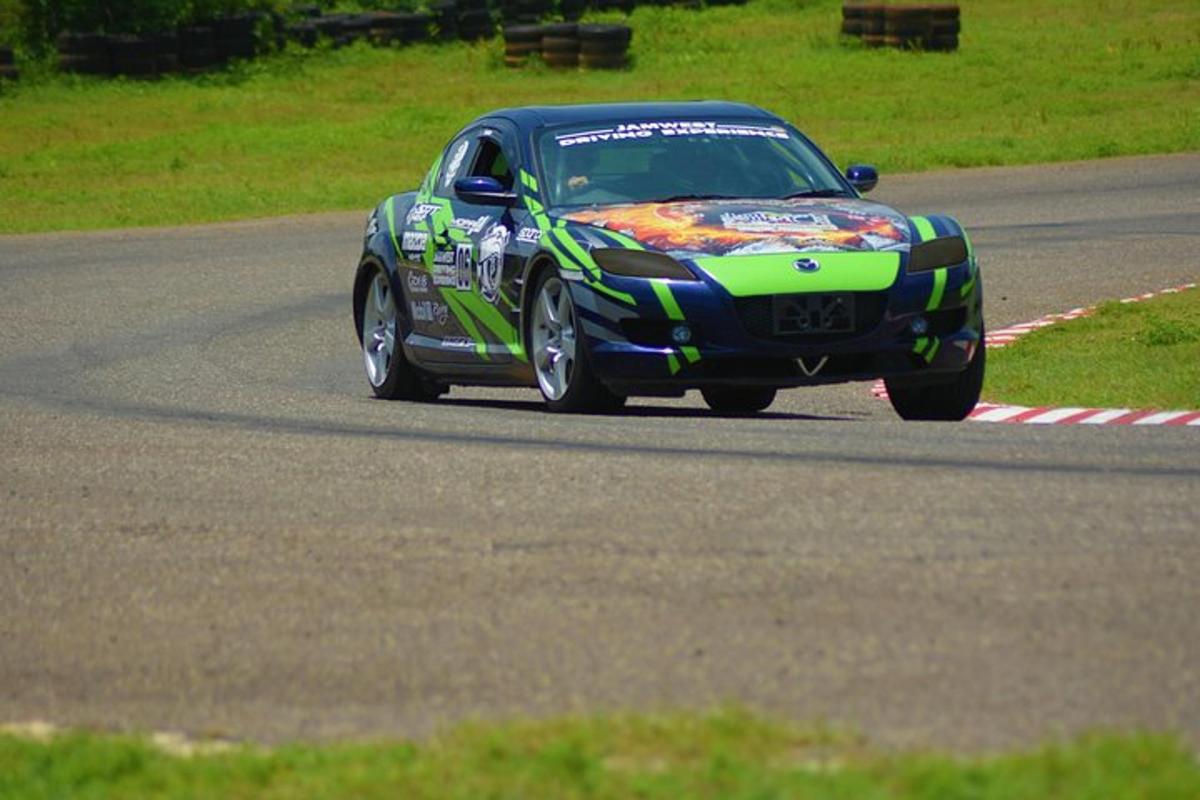 a car driving down a road on a track