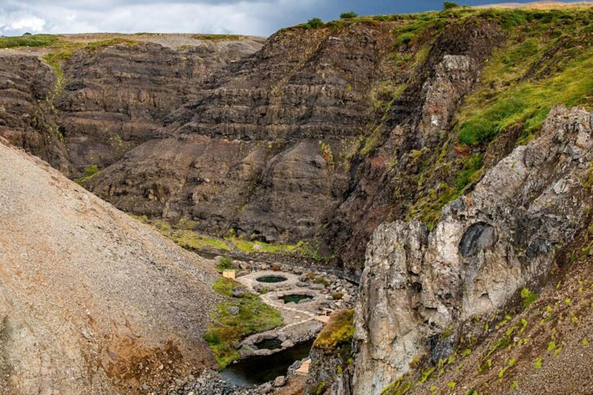 a rocky mountain with a river in the middle
