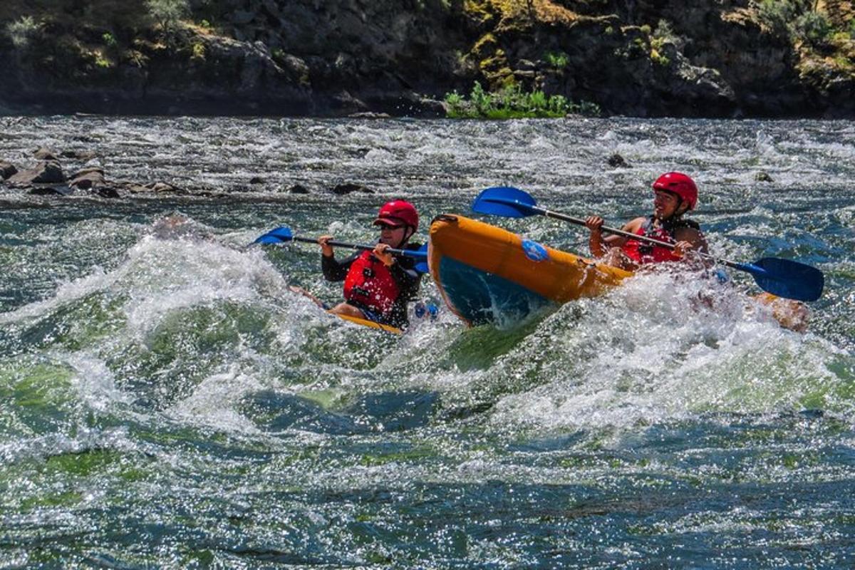 two people in a raft in a river