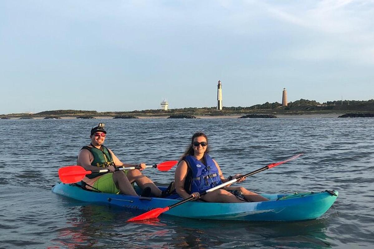 two people sitting in a kayak in the water