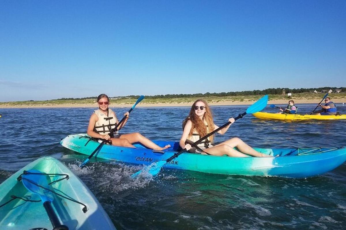 a group of people on kayaks in the water