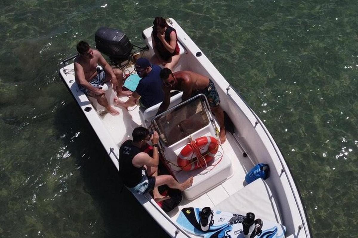 a group of people on a boat in the water