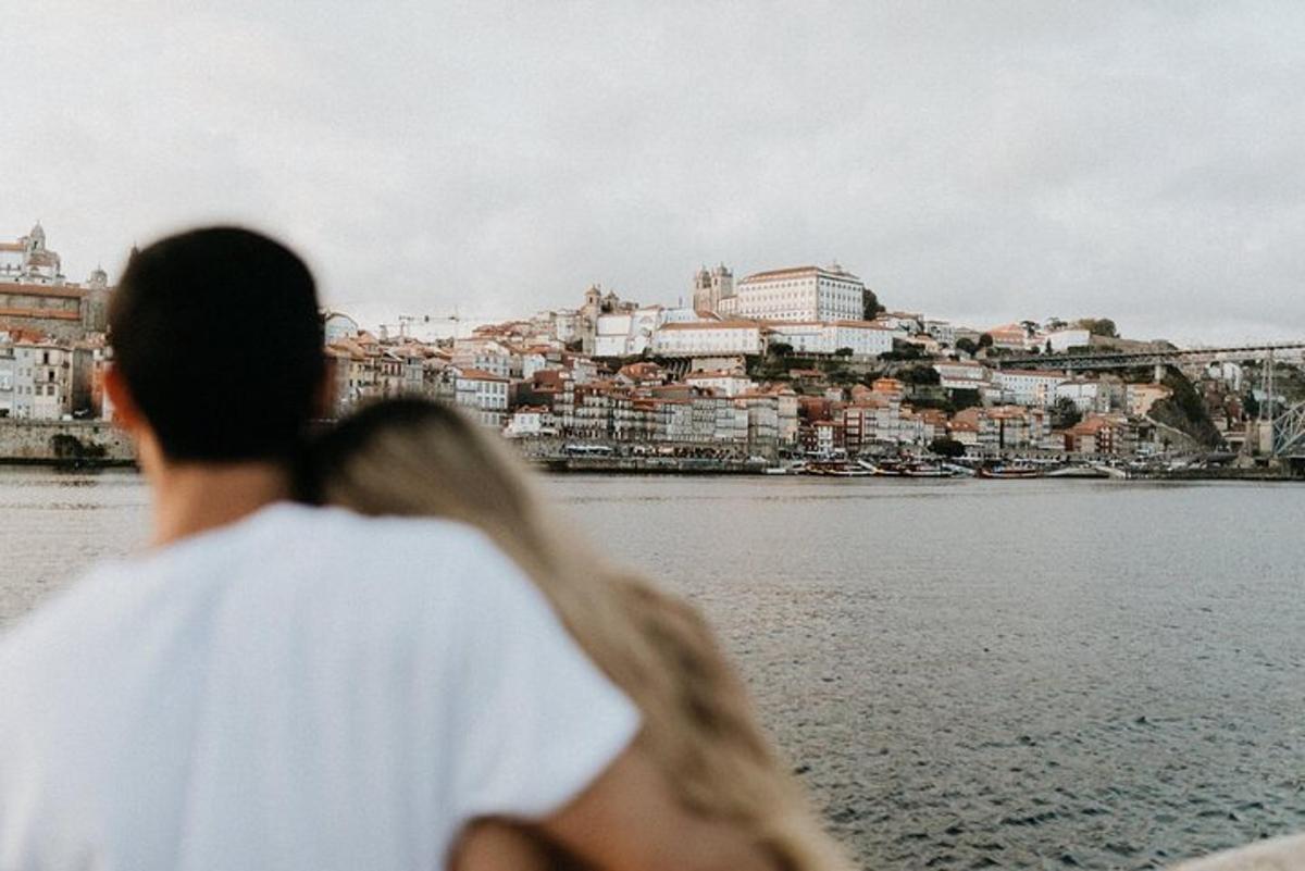 a man and a woman looking at the water