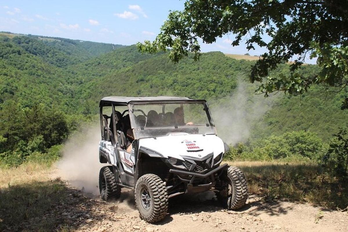 a white atv driving on a dirt road