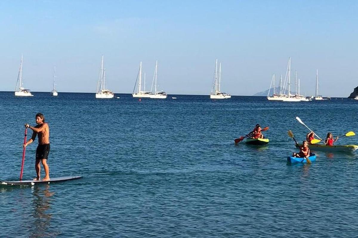 a group of people on paddle boards in the water