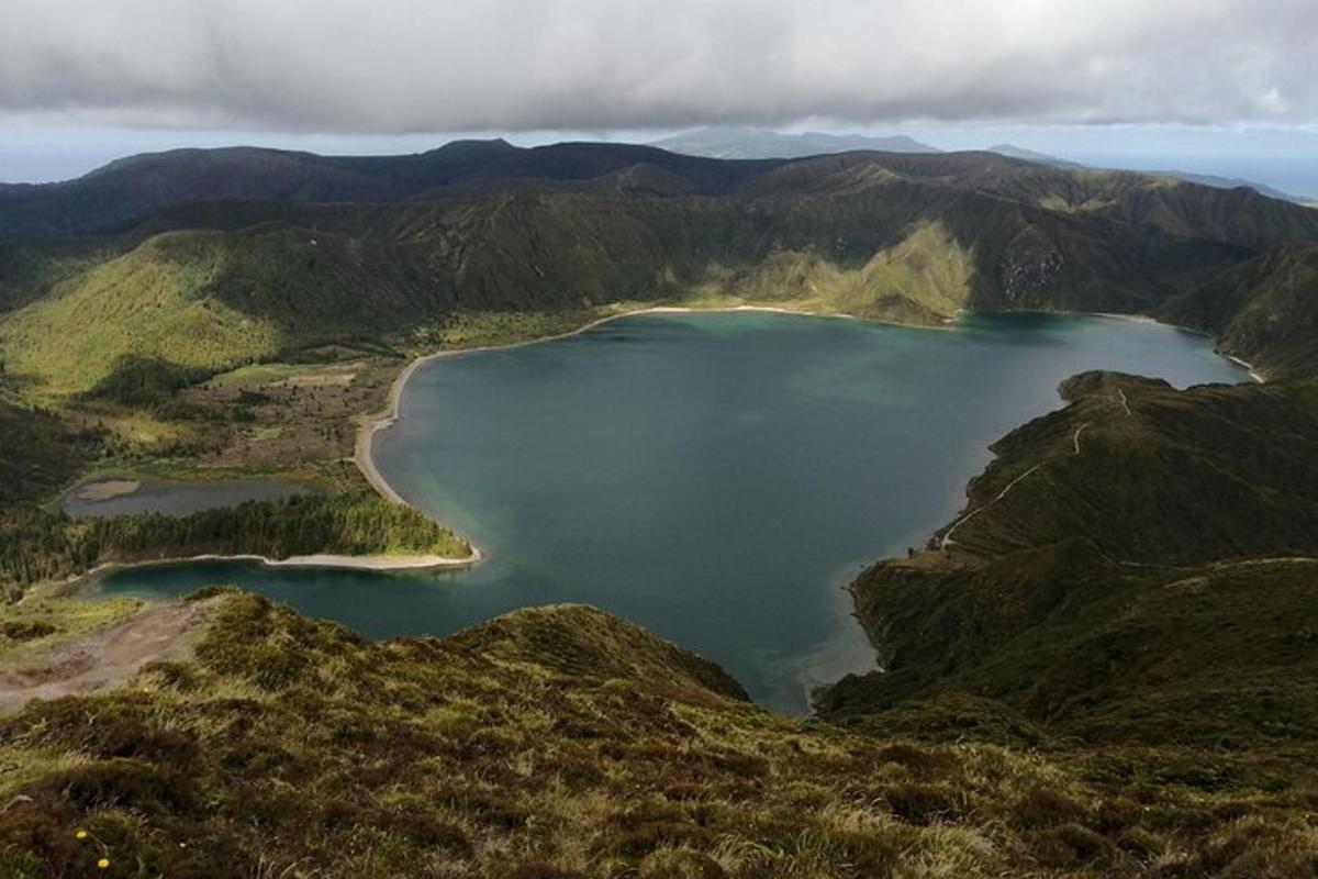 an aerial view of a lake in the mountains