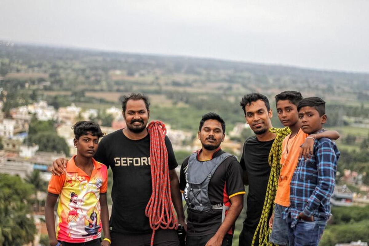 a group of men standing on top of a hill