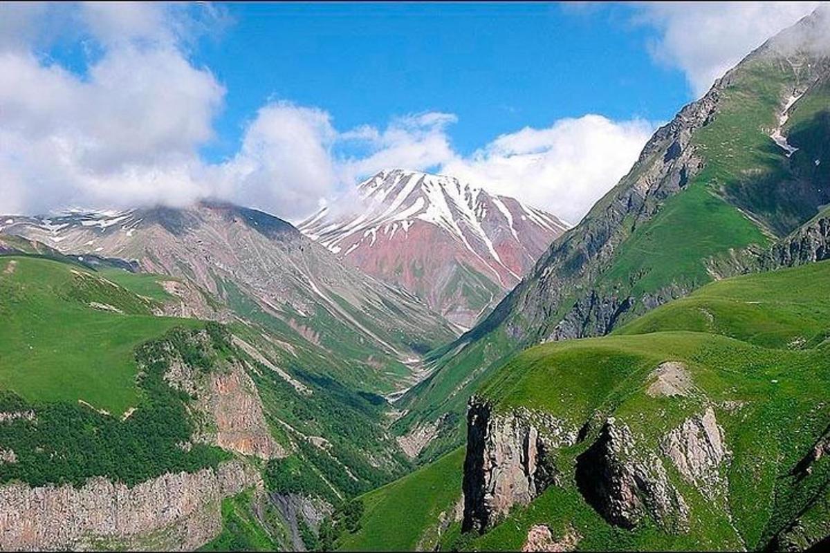 a view of a mountain with a snow covered mountain