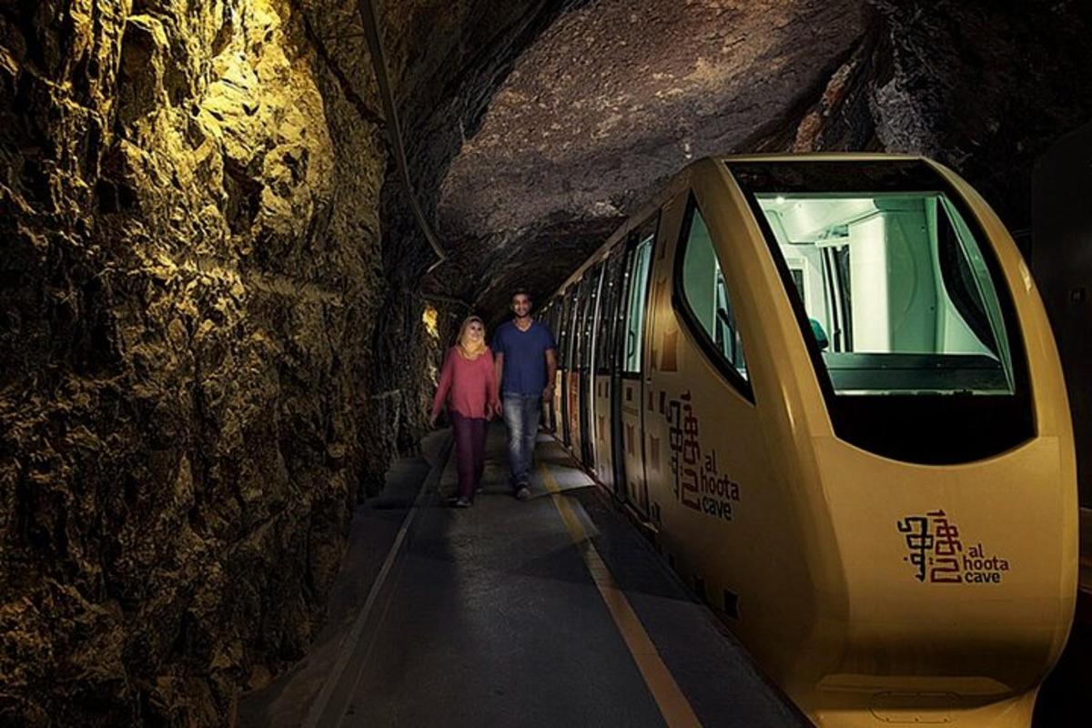 a man and woman standing next to a subway train