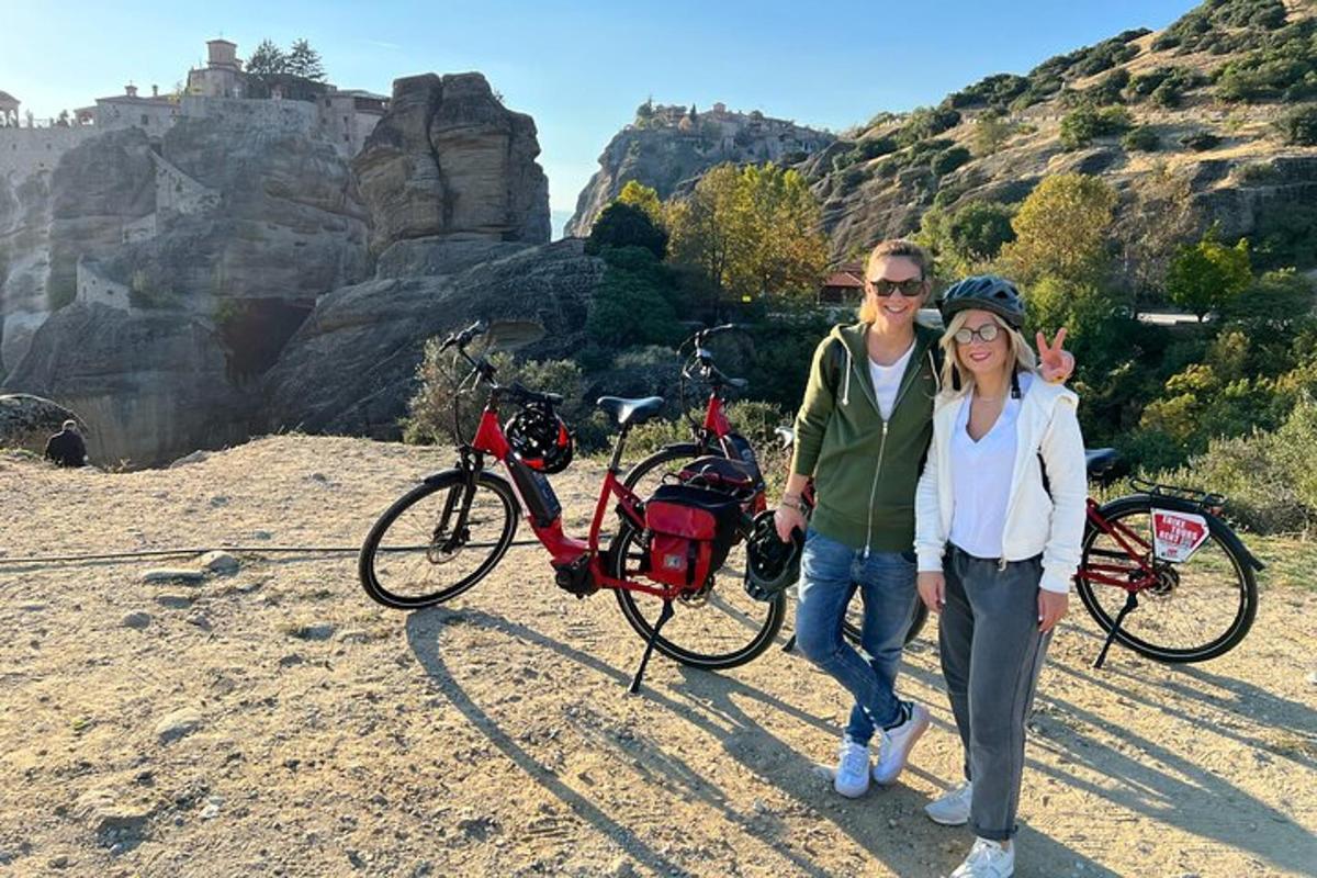 a man and a woman standing next to their bikes