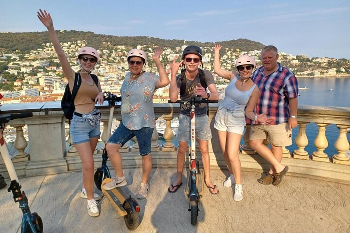 a group of people on scooters on a bridge